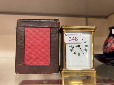 Lot 348 - A cased brass and five glass carriage clock
