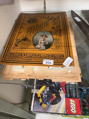 Lot 354 - A late Victorian postcard album with contents