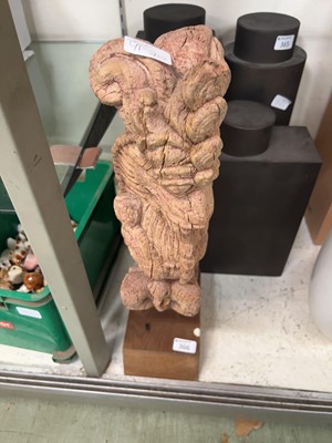 Lot 366 - A distressed eastern carved wooden figure of...