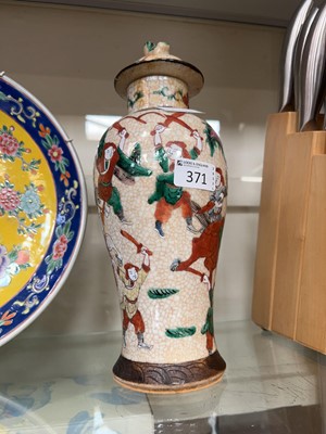 Lot 371 - An oriental Satsuma style lidded vase with...