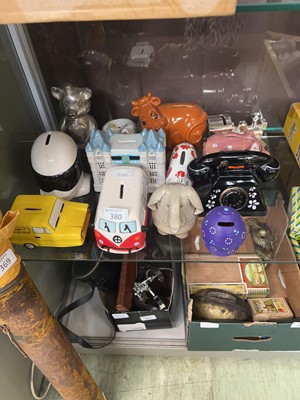 Lot 380 - A collection of thirteen assorted money boxes...