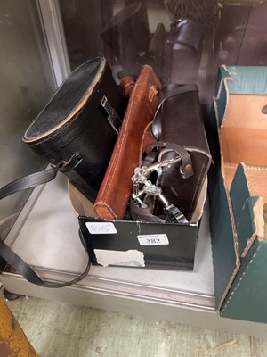 Lot 382 - A box containing a small assortment of cameras...