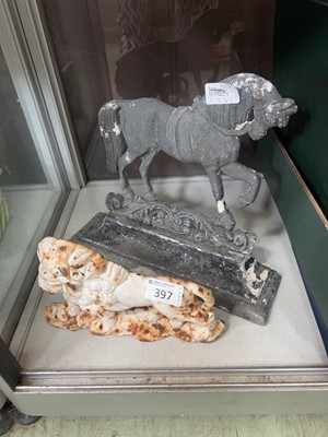 Lot 397 - A white painted cast metal doorstop in the...