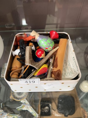 Lot 419 - A small tin of various whistles
