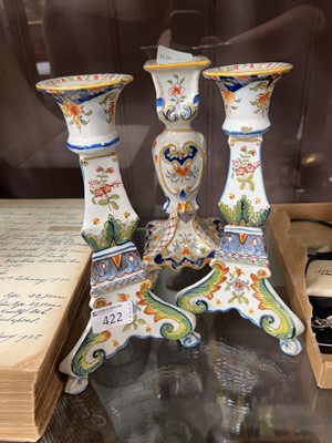 Lot 422 - Three ceramic Faience style candlesticks
