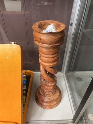 Lot 427 - A turned wooden candlestick
