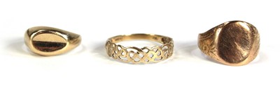Lot 762 - Two 9ct yellow gold signet rings and a Celtic...
