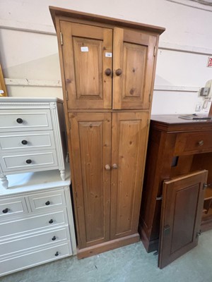 Lot 196 - A pine double door cabinet with cabinet over