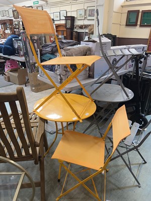 Lot 199 - A metal yellowbistro table and two folding chairs