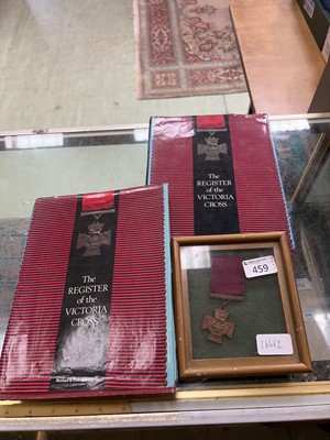Lot 459 - A replica Victoria cross and two books...