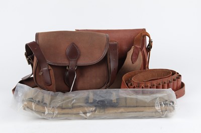 Lot 1107 - Two leather cartridge bags, a leather 16 bore...