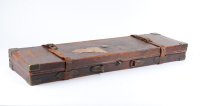 Lot 29 - Oak and leather gun case, red baize lined...