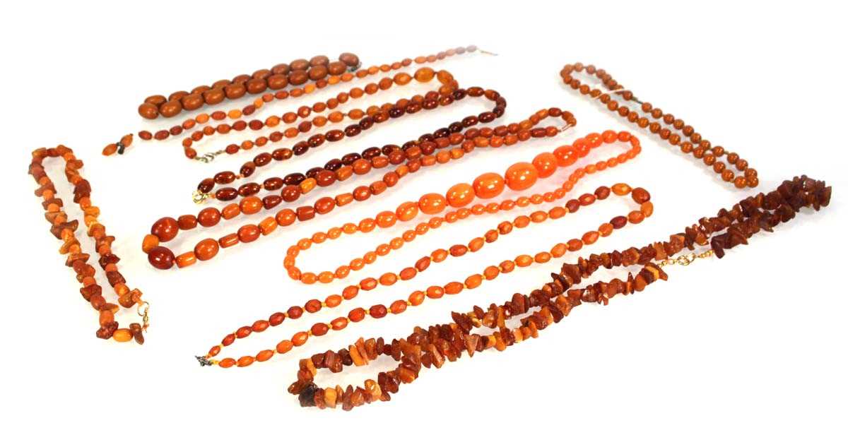 Lot 774 - Ten cognac amber-style and costume necklaces (10)