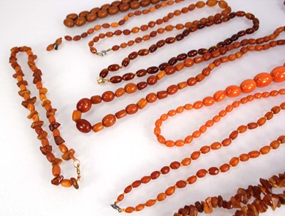 Lot 774 - Ten cognac amber-style and costume necklaces (10)