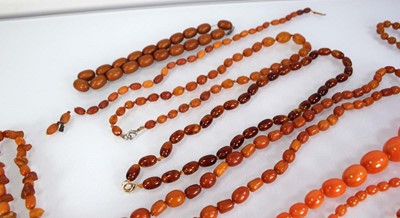 Lot 774 - Ten cognac amber-style and costume necklaces (10)