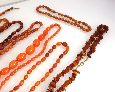 Lot 774 - Ten cognac amber-style and costume necklaces (10)