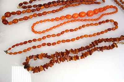 Lot 774 - Ten cognac amber-style and costume necklaces (10)