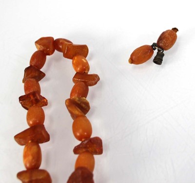 Lot 774 - Ten cognac amber-style and costume necklaces (10)