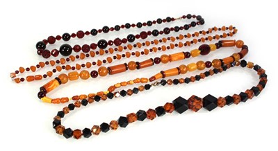 Lot 775 - Four amber-style and costume necklaces (4)