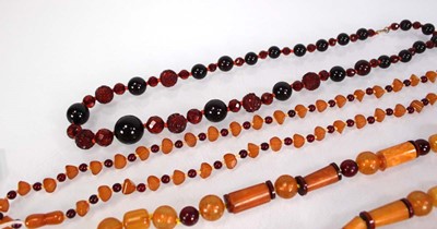 Lot 775 - Four amber-style and costume necklaces (4)