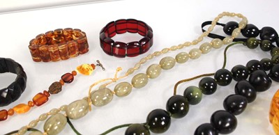Lot 776 - Seven amber-style and costume bracelets and...