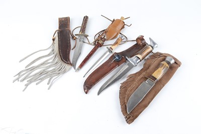 Lot 1158 - Four antler-grip knives in decorative sheaths...