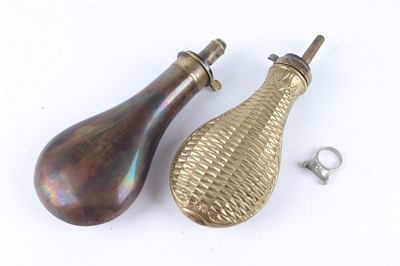 Lot 1161 - Two powder flasks inc. Dixon, and a 12 bore G...