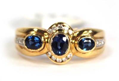 Lot 780 - An 18ct yellow gold ring set three oval...