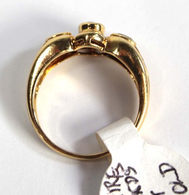 Lot 780 - An 18ct yellow gold ring set three oval...