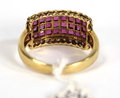 Lot 781 - An 18ct yellow gold ring set three rows of...