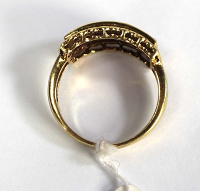 Lot 781 - An 18ct yellow gold ring set three rows of...