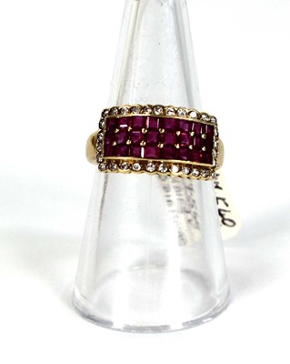 Lot 781 - An 18ct yellow gold ring set three rows of...