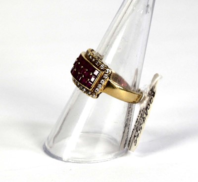 Lot 781 - An 18ct yellow gold ring set three rows of...