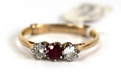 Lot 782 - An 18ct yellow gold ring set small ruby and...