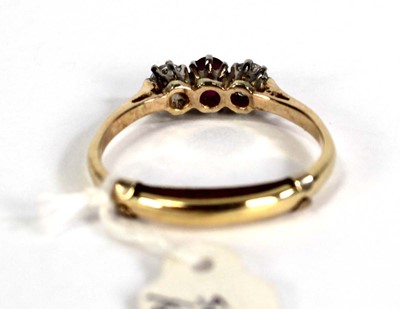 Lot 782 - An 18ct yellow gold ring set small ruby and...