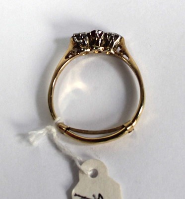 Lot 782 - An 18ct yellow gold ring set small ruby and...