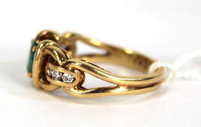 Lot 784 - An 18ct yellow gold ring set oval emerald and...