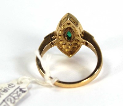 Lot 785 - An 18ct yellow gold ring set emerald and small...
