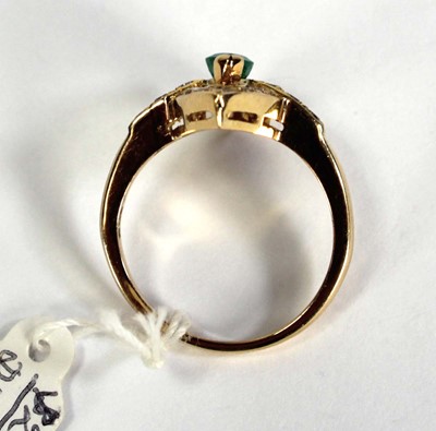 Lot 785 - An 18ct yellow gold ring set emerald and small...