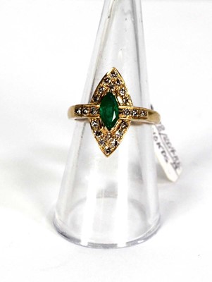 Lot 785 - An 18ct yellow gold ring set emerald and small...