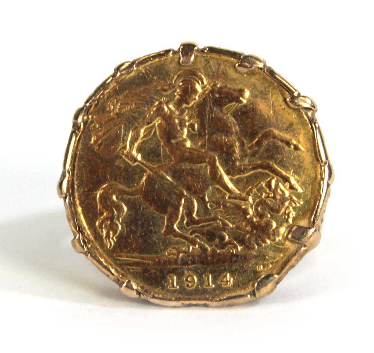 Lot 403 - A 9ct yellow gold ring set half sovereign...