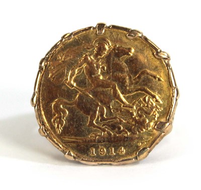Lot 403 - A 9ct yellow gold ring set half sovereign...