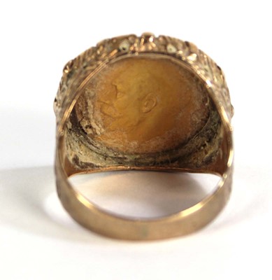 Lot 403 - A 9ct yellow gold ring set half sovereign...