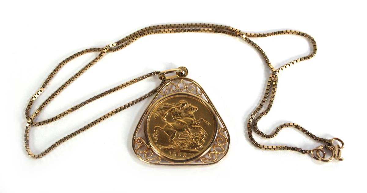 Lot 404 - A 9ct yellow gold boxlink necklace suspending...