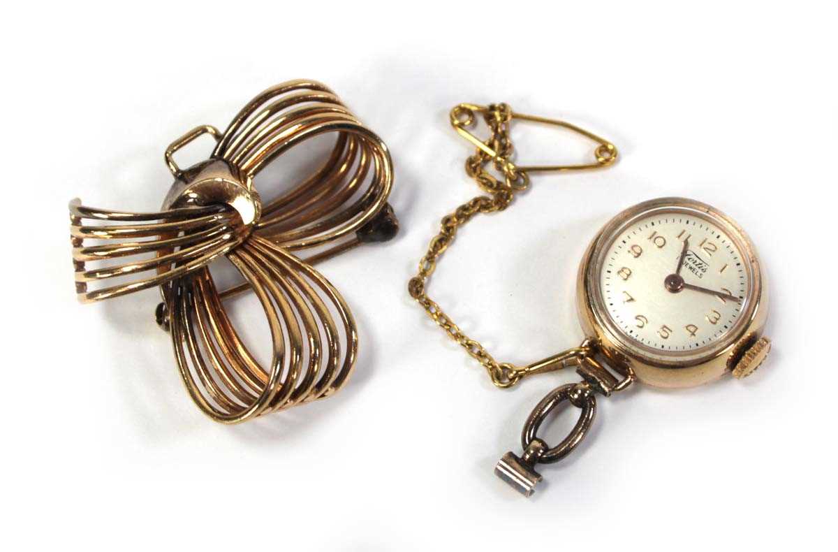 Lot 426 - A gold plated nurses-type watch by Fortis, the...