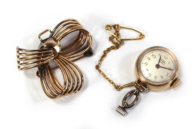 Lot 426 - A gold plated nurses-type watch by Fortis, the...