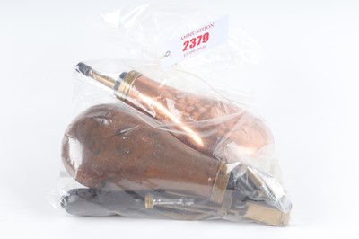 Lot 2379 - Four powder flasks and black powder shooting...