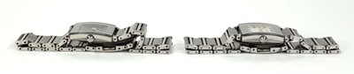 Lot 467 - A pair of ladies day/night stainless steel...