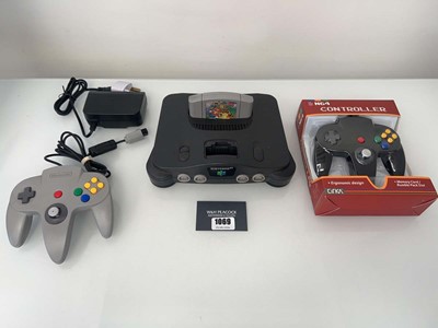 Lot 1069 - Nintendo 64 (N64) with two controllers (one...