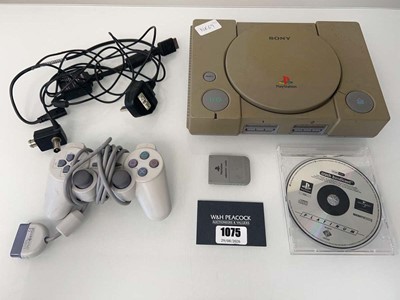 Lot 1075 - Sony PlayStation with one controller and Crash...
